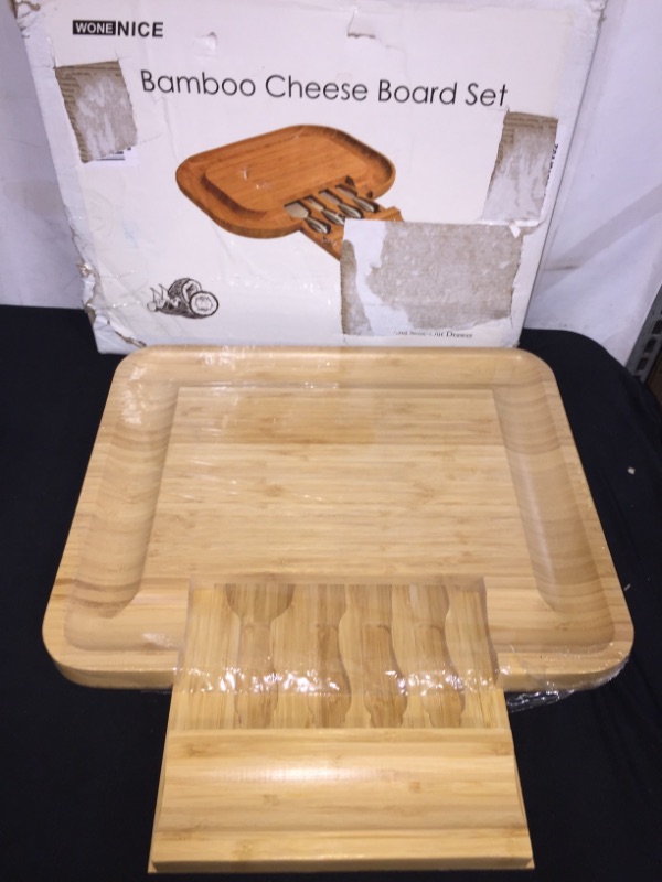 Photo 1 of Cheese Board Set with Cheese Knives and Utensils - Bamboo Wood Serving Tray with Slide-Out Hidden Drawer and Wide Juice Groves - Charcuterie Platter for Serving Wine, Cheese, Meat, and More