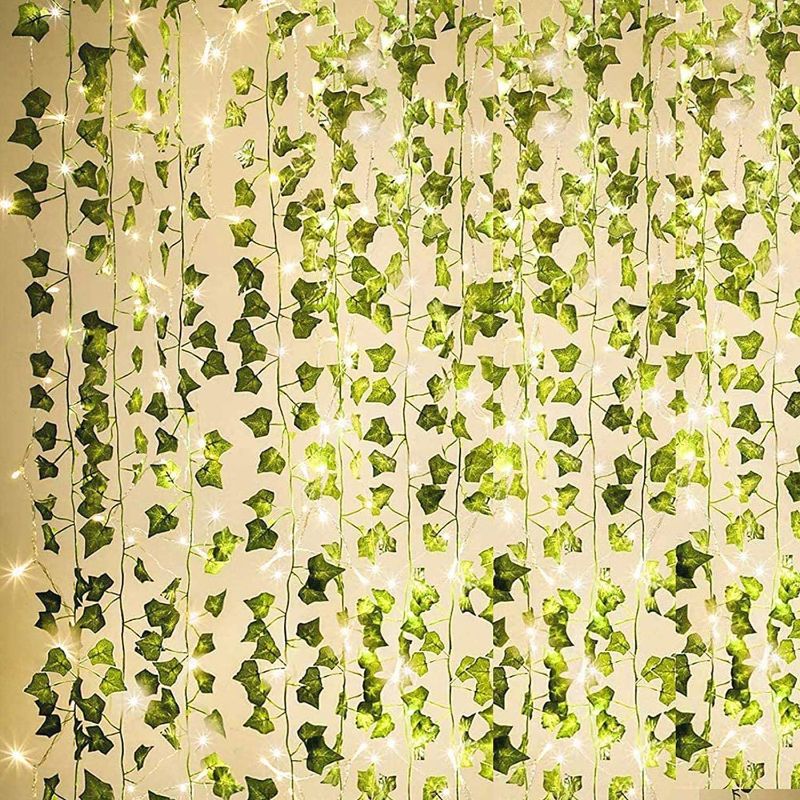 Photo 1 of 84Ft 12 Pack Artificial Ivy Garland Fake Plants, Outdoor Fake Vine UV Resistant Indoor Hanging Garland with 80 LED 33 Ft String Light, Hanging for Home, Kitchen, Garden, Wedding Décor (Green)
