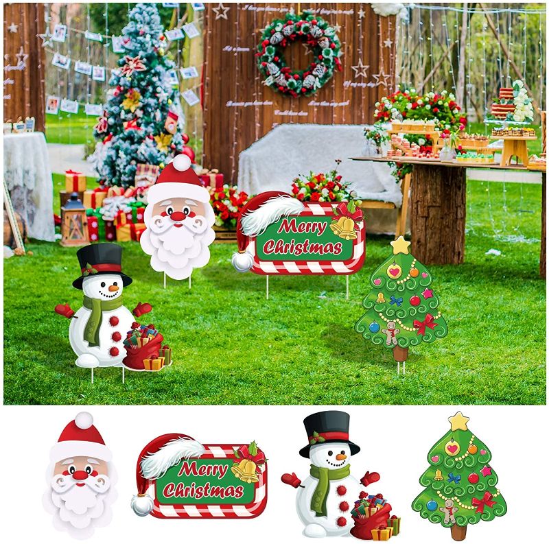 Photo 1 of Alimtois Christmas Decorations Outdoor Yard, 4 Pack Waterproof Reusable Yard Sign Stakes Snowman Santa Claus Christmas Tree and Merry Christmas Sign, for Home Lawn Pathway Walkway Themed Party