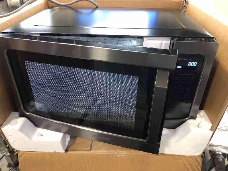 Photo 3 of Toshiba ML-EM45PIT(BS) Microwave Oven with Inverter Technology, LCD Display and Smart Sensor, 1.6 Cu.ft, Black Stainless Steel
** HAS A CRACK ON TOP OF DOOR **