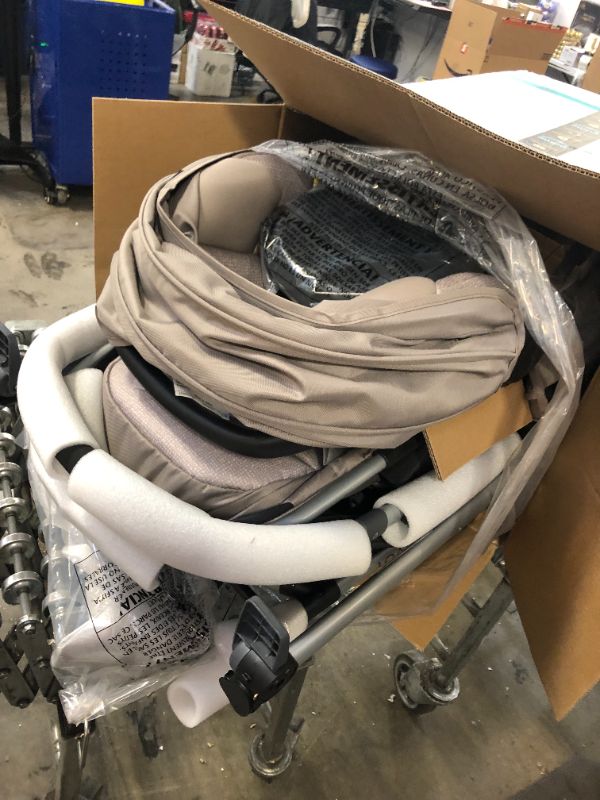 Photo 1 of Evenflo Pivot Modular Travel System with SafeMax Infant Car Seat - Sandstone