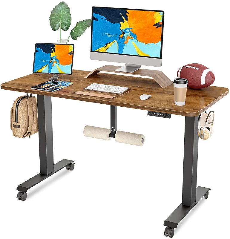 Photo 1 of FAMISKY Standing Desk Dual Motors, Adjustable Height Electric Stand up Desk with Footrest, 48 x 24 Inches Sit Stand Home Office Desk, Ergonomic Workstation Black Steel Frame/Rustic Brown Wood Top
