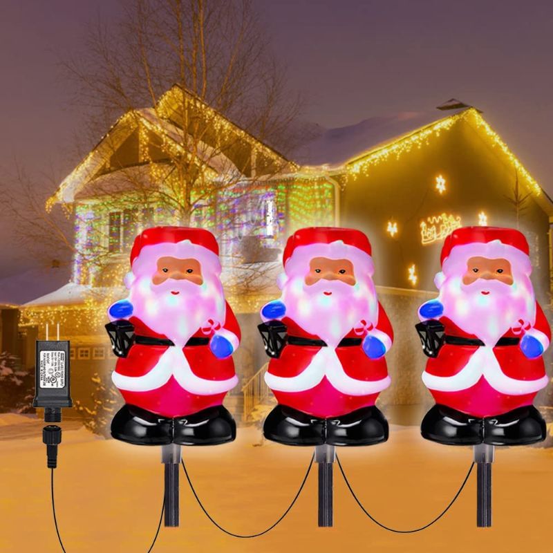 Photo 1 of Christmas Pathway Lights Outdoor with Rotating Light Cute 3D Shape 3 in 1 Santa Xmas Light 5V Waterproof Snowproof Christmas Garden Stakes Landscape Lights for Indoor, Outdoor, Yard, Walkway, Patio
