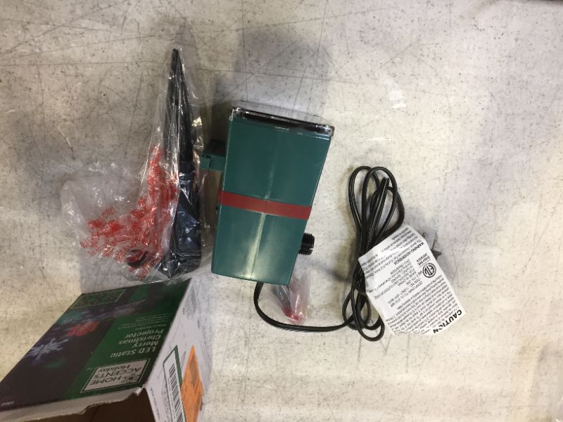Photo 1 of Gemmy LED Merry Christmas Whirl-A-Motion Outdoor Light Show Projector, Reindeer Pattern, Red, Green, Blue, White

