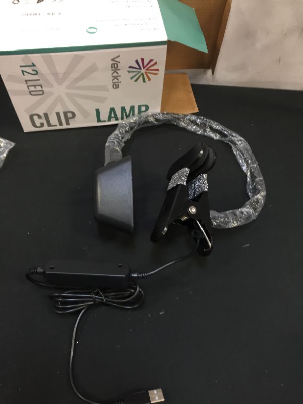 Photo 1 of Vekkia Clip on Light,Reading Light Clip to Headboard/Light Color Changeable/Night Bed Reading Lamp Clip on Desk and Computer,12 LED 3 Colors x 10 Adjustable Brightness (Triangle)