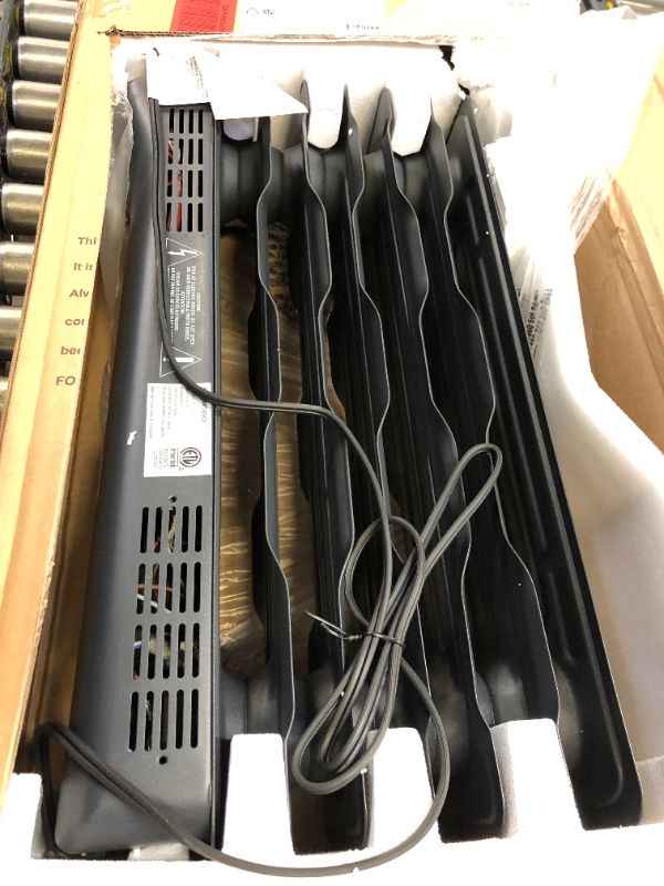 Photo 1 of Amazon Basics Portable Radiator Heater with 7 Wavy Fins, Manual Control, Black, 1500W NO WHEELS 
