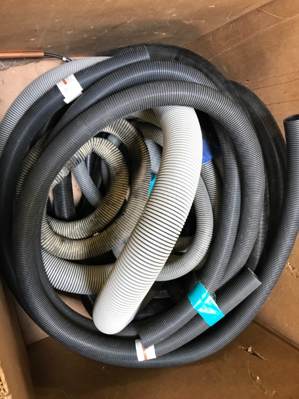 Photo 1 of  VARIOUS VACUUM STYLE HOSES.  3in DIA GREY VACUUM STYLE HOSE.  2.5in ROTO BRUSH STYLE VACUUM HOSE.ASSORTED 2in DIA AND SMALLER VACUUM HOSES. 2 METAL VACUUM TUBES  EXACT LENGTH OF HOSES UNKNOWN.  