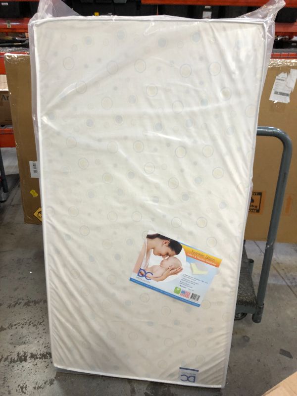 Photo 3 of Delta Children Twinkle Stars Dual Sided - Premium Sustainably Sourced Fiber Core Crib and Toddler Mattress 5X27.5X52 INCHES