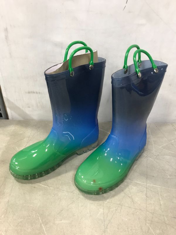 Photo 2 of DKSUKO Kids Light Up Rain Boots Waterprof Rubber Boots with Easy-on Handles (size 5/6)