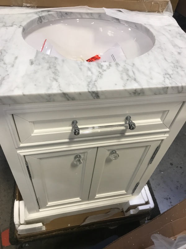 Photo 1 of 24 in. W x 22 in. D x 34 in. H Bath Vanity in White with Marble Vanity Top in Carrara White with White Basin
