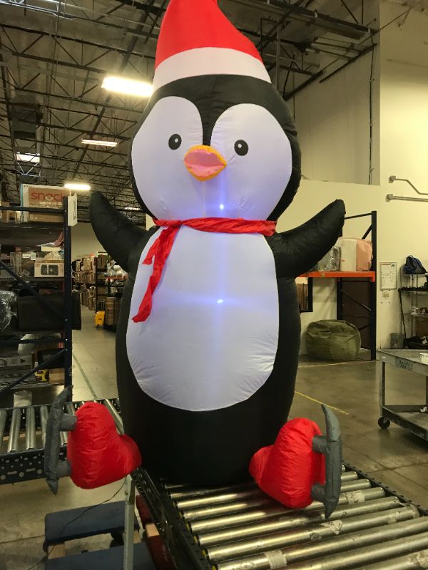 Photo 2 of 6.5 ft Pre-Lit LED Airblown Penguin with Skates Christmas Inflatable
