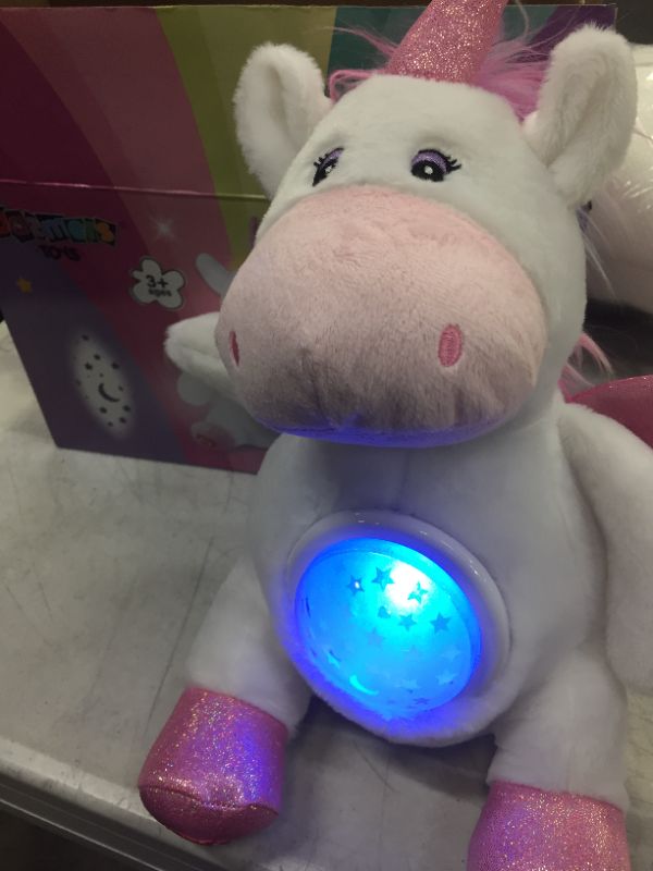 Photo 2 of Plush Unicorn Star Projector Night Light Stuffed Toy
