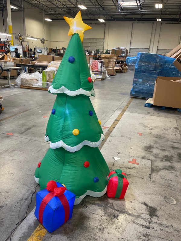 Photo 1 of AIRBLOWN INFLATABLE CHRISTMAS TREE DECORATED WITH ORNAMENTS AND PRESENTS BESIDE IT