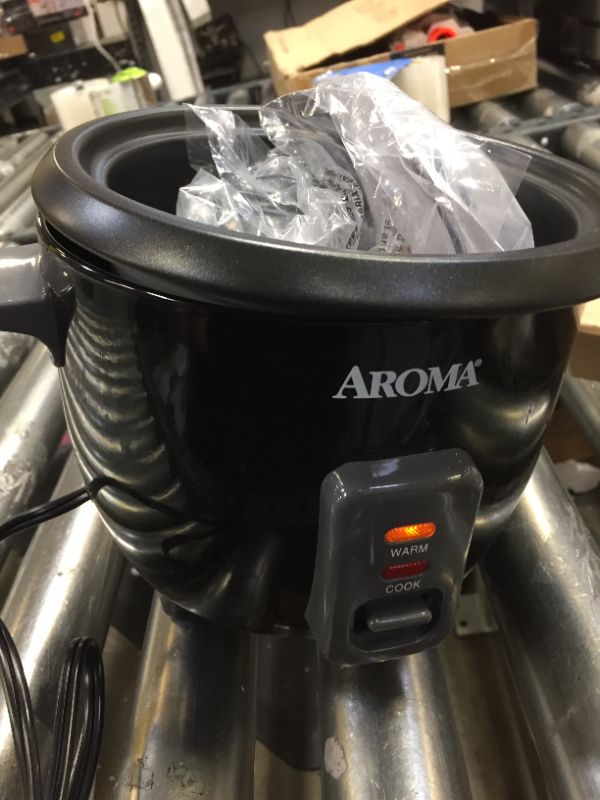 Photo 2 of 6-Cup Black Rice Cooker with Removable Steam Tray, BENT' DOES NOT SIT FLUSH (POPS UP) 