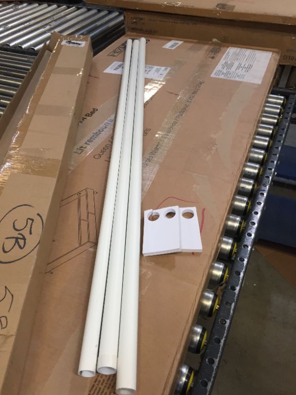 Photo 1 of curtain or shower rod --plastic 