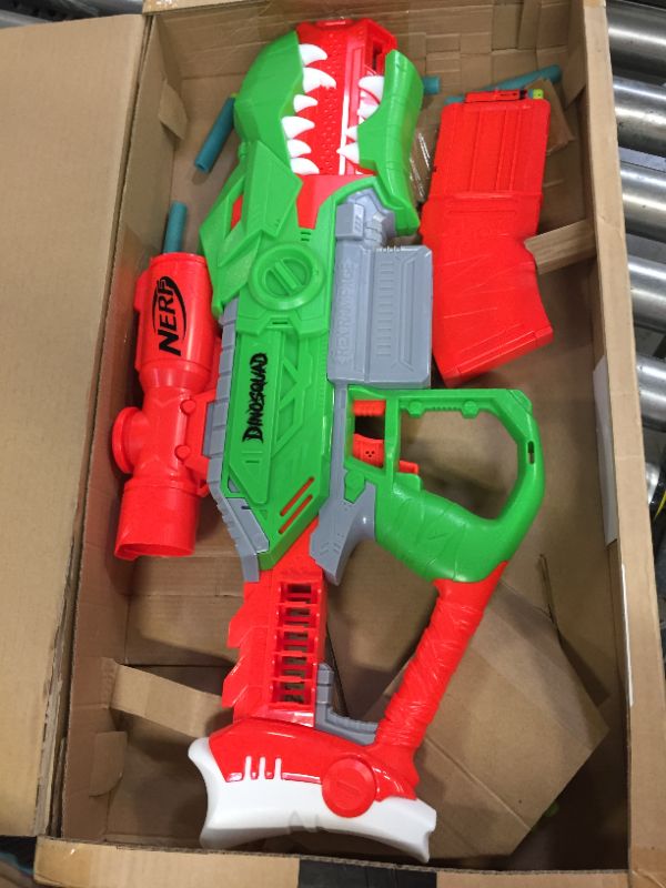 Photo 3 of Nerf DinoSquad Rex-Rampage Motorized Dart Blaster, 10-Dart Clip, 20 Nerf Darts, 10-Dart Storage- T-Rex Dinosaur Design