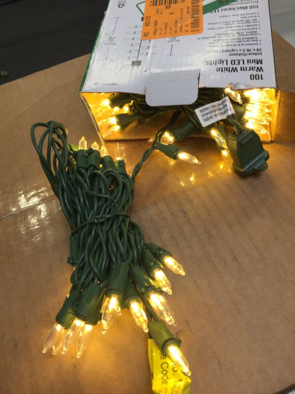 Photo 2 of 29.5 ft. 100-Light Warm White Mini LED Lights on Green Wire
