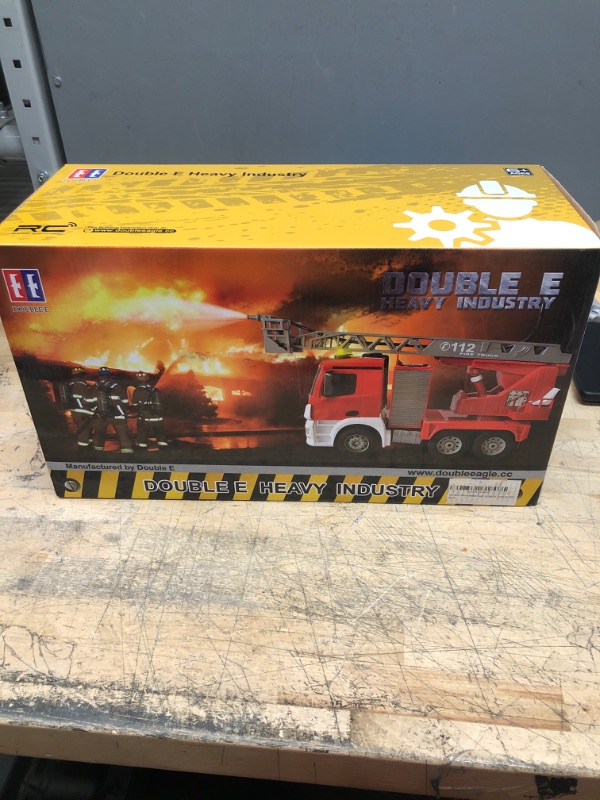 Photo 2 of DOUBLE E Remote Control Fire Truck 10 Channel Water Pump 18 Inch Extendable Ladder Fire Engine with Working Sounds Lights Rechargeable 2.4GHz Toy Trucks for Kids