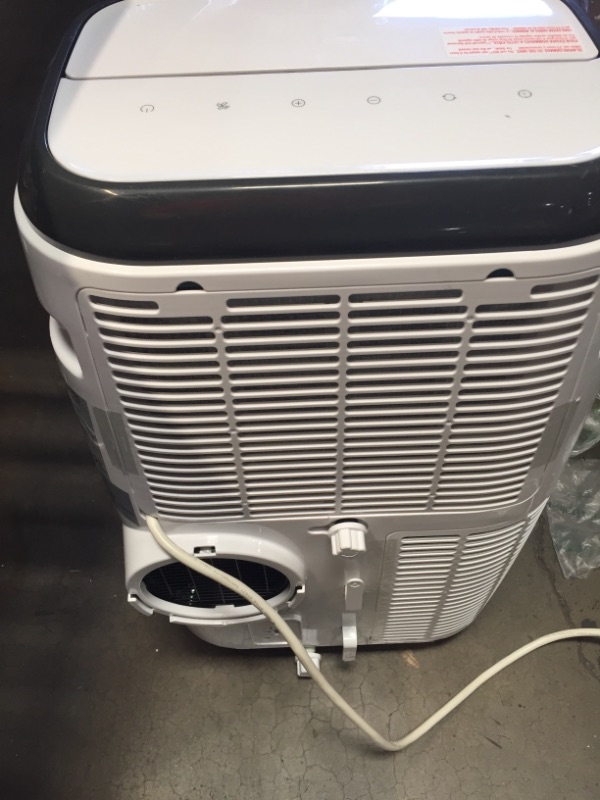 Photo 5 of **MINOR DAMAGE** BLACK+DECKER 12,000 BTU Portable Air Conditioner with Heat and Remote Control, White
