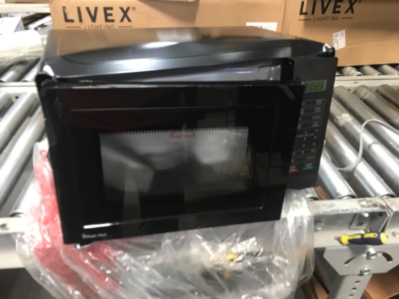 Photo 1 of (MAJOR DOOR DAMAGE; DENTED) Magic Chef 0.7 cu. ft. 700-Watt Countertop Microwave in Black
