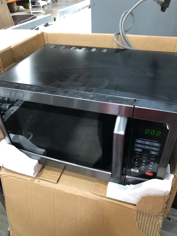 Photo 2 of ***PARTS ONLY***
Toshiba EM131A5C-BS Microwave Oven with Smart Sensor, Easy Clean Interior, ECO Mode and Sound On/Off, 1.2 Cu Ft, Black Stainless Steel
