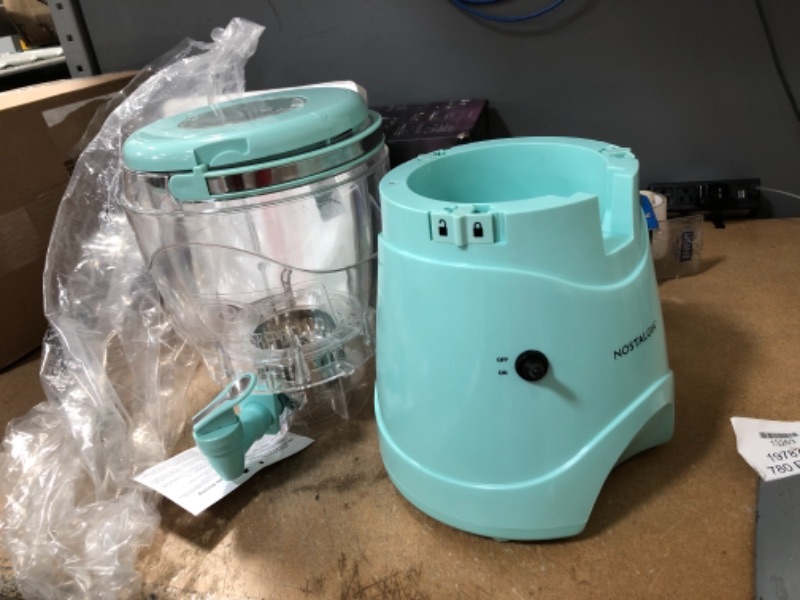 Photo 2 of **DAMAGED**
Nostalgia 128-Ounce Margarita Maker & Slushie Machine, Makes One Gallon Frozen Drinks, Stainless Steel Flow Spout and Carry Handle, Creamy Texture, Double Insulated, Easy Clean, 1 gallon, Aqua
