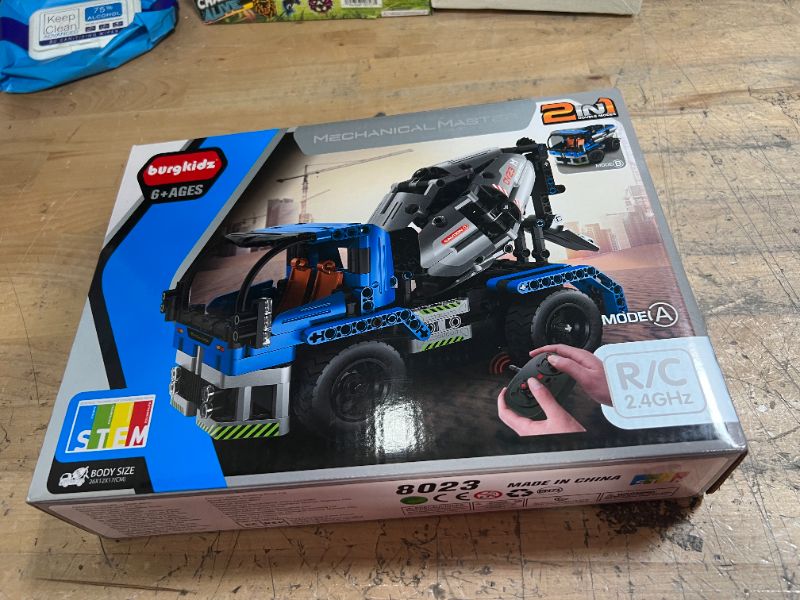 Photo 2 of burgkidz STEM Engineering Building Blocks Toys 2-in-1 Dump Truck or Concrete Mixer Build Set with Remote Control, RC Car Toys for Boys and Girls Ages 6 7 8 9 10 11 12 Years Old
