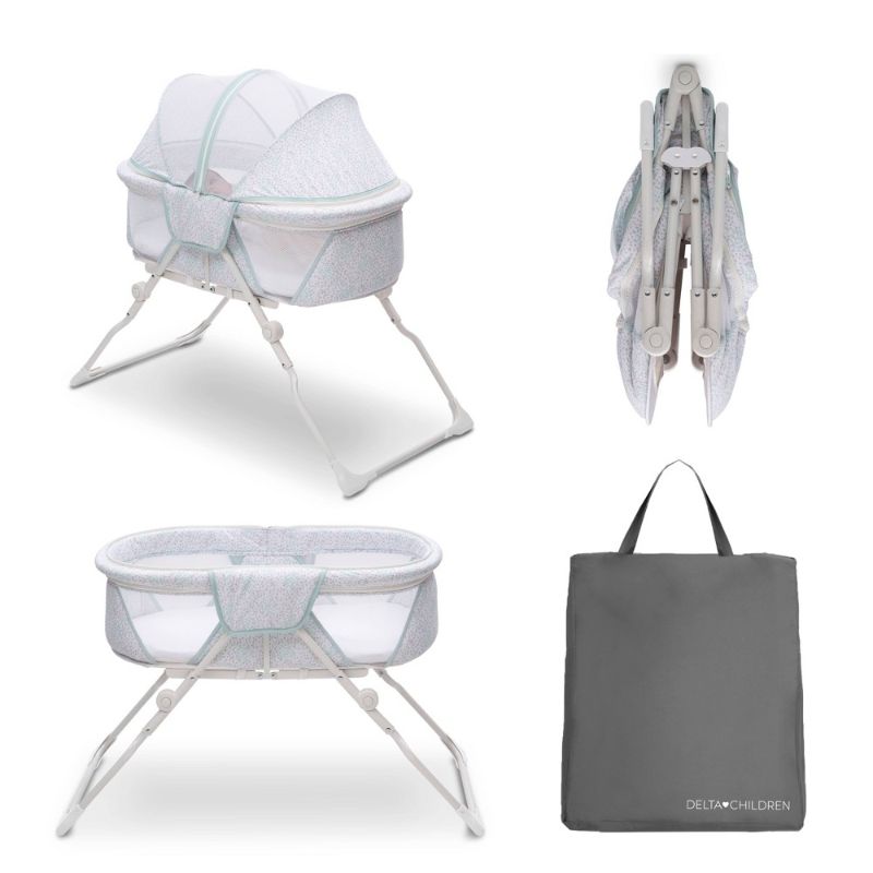 Photo 1 of Delta Children EZ Fold Ultra Compact Travel Bassinet Baby Crib, Mirage White
