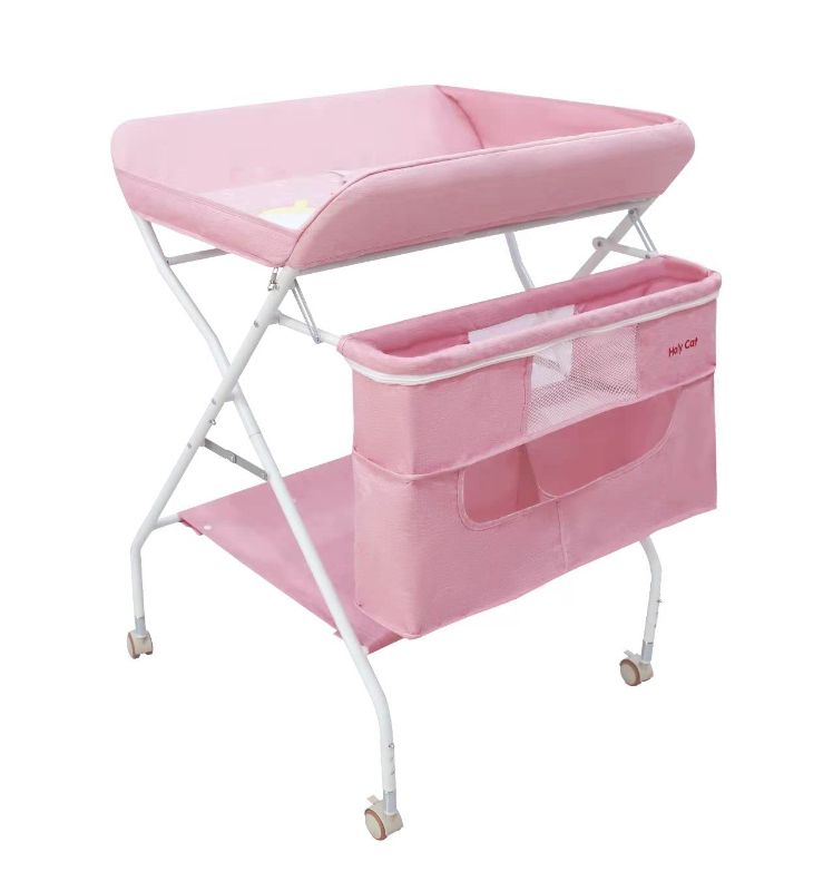 Photo 1 of Holy Cat Baby Portable Changing Table with Wheels Adjustable Height Folding Infant Diaper Station Mobile Nursery Stand with Newborn Lightweight Large Storage Rack - Pink
