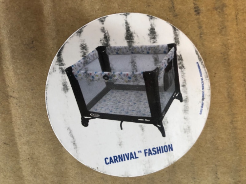 Photo 1 of Graco Pack and Play Portable Playard, Push Button Compact Fold, Carnival