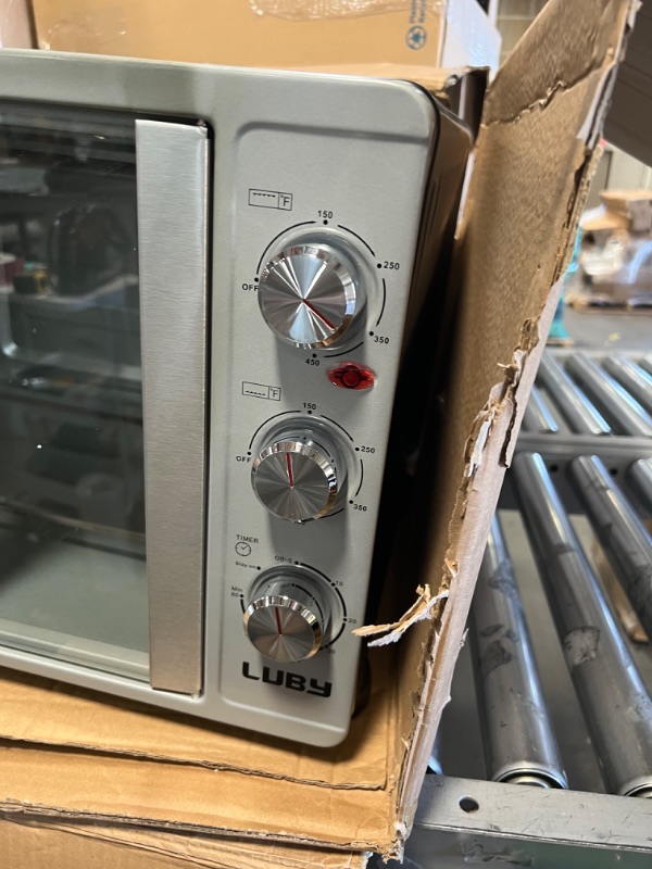 Photo 4 of LUBY Large Toaster Oven Countertop, French Door Designed, 55L, 18 Slices, 14'' pizza, 20lb Turkey, Silver
MINOR DAMAGE TO THE SIDE ITS DENTED