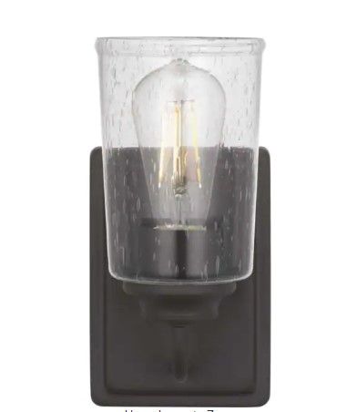 Photo 1 of 
Hampton Bay
Evangeline 4.5 in. 1-Light Modern Bronze Indoor Wall Farmhouse Sconce with Clear Seeded Glass Shade