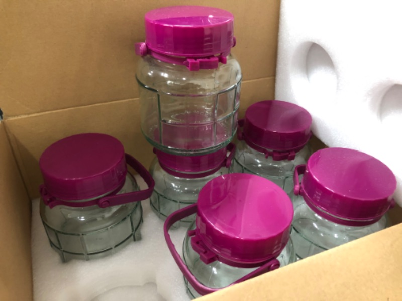 Photo 2 of GLASS CANNING JARS WITH PURPLE PLASTIC LID WITH HANDLE 6PK