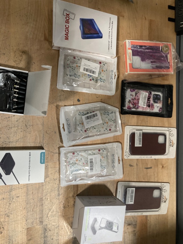 Photo 1 of **NON-REFUNDABLE** Assorted Amazon Electronics; IPhone 11/13 Cases, Protectors, Mount 
