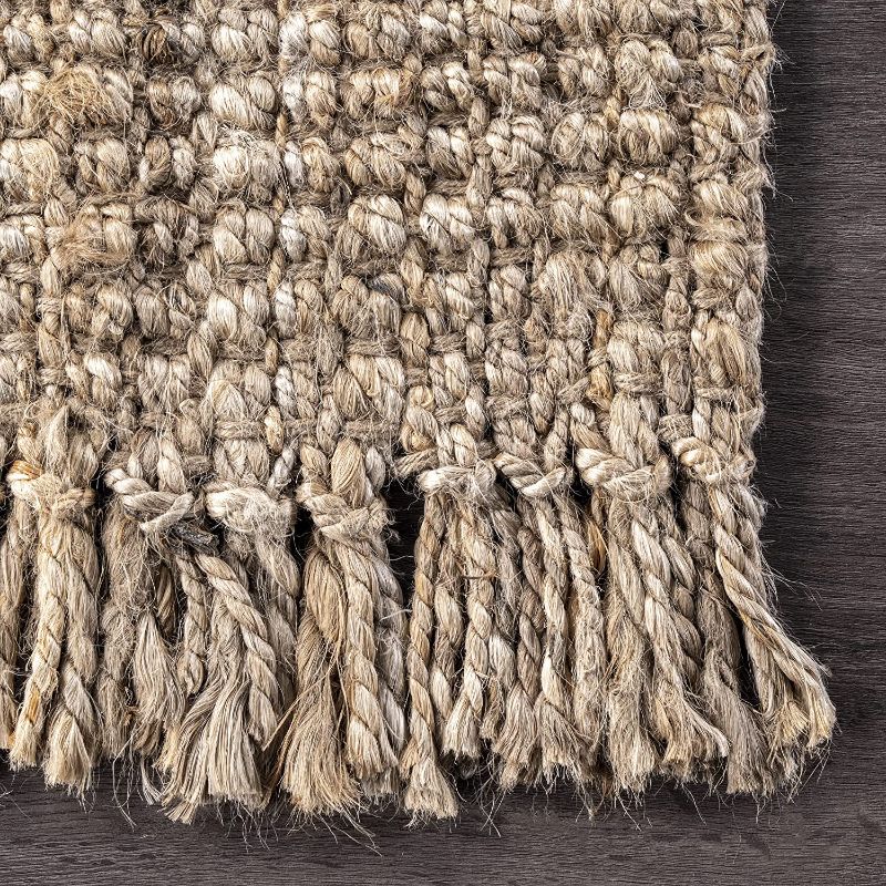 Photo 1 of 2.5'x6' jute rug with tassels 