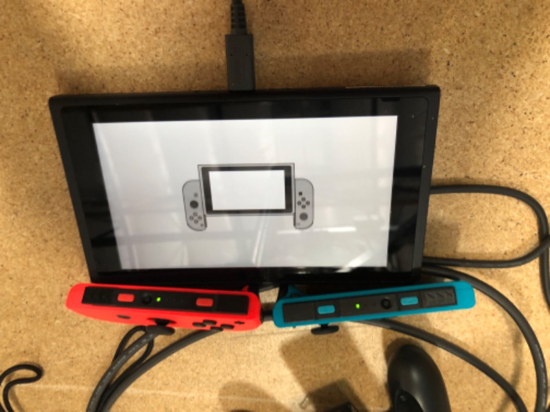 Photo 8 of Nintendo Switch with Neon Blue and Neon Red Joy-Con

