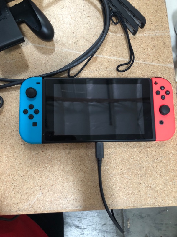 Photo 3 of Nintendo Switch with Neon Blue and Neon Red Joy-Con

