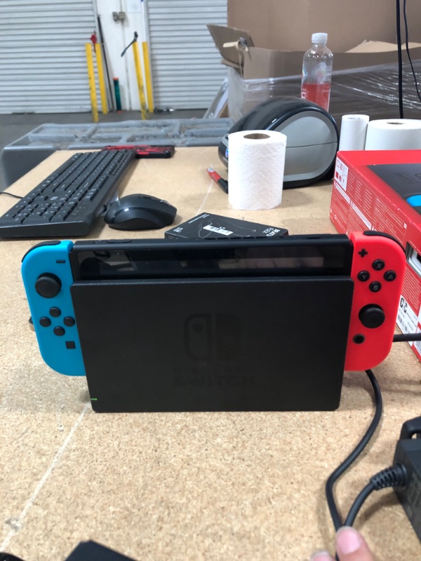 Photo 7 of Nintendo Switch with Neon Blue and Neon Red Joy-Con

