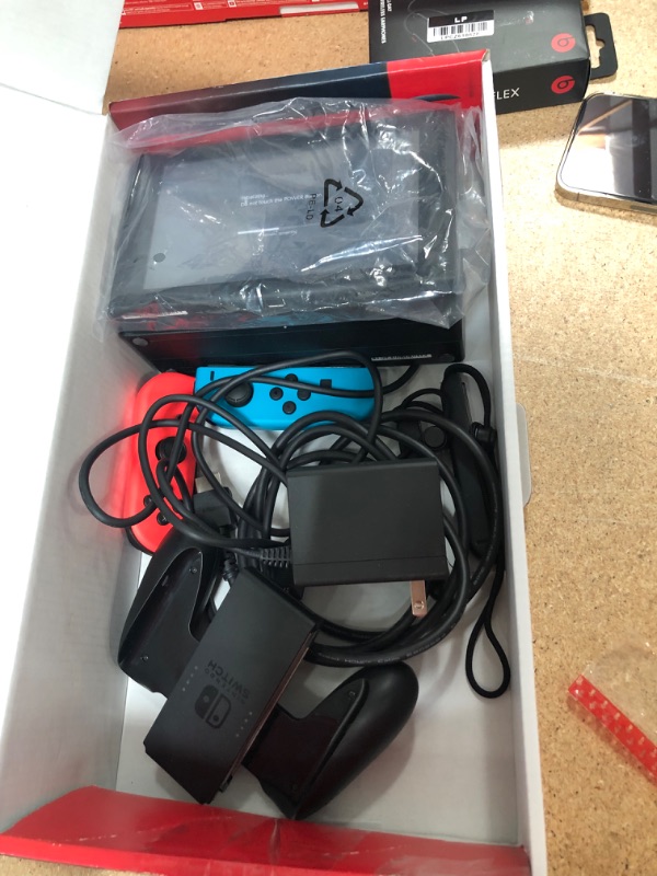 Photo 1 of Nintendo Switch with Neon Blue and Neon Red Joy-Con

