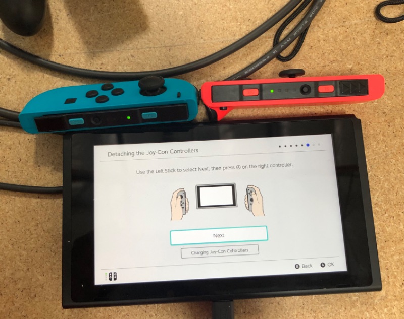 Photo 12 of Nintendo Switch with Neon Blue and Neon Red Joy-Con

