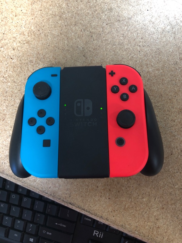 Photo 13 of Nintendo Switch with Neon Blue and Neon Red Joy-Con

