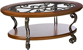 Photo 1 of (CRACKED TABLE LEG INSERTION; SCRATCHED/DENTED) Signature Design by Ashley Nestor Traditional Oval Coffee Table with Beveled Glass Top, Scrollwork Underlay and 1 Fixed Shelf, Dark Brown, 34.25"D x 48"W x 20.25"H

