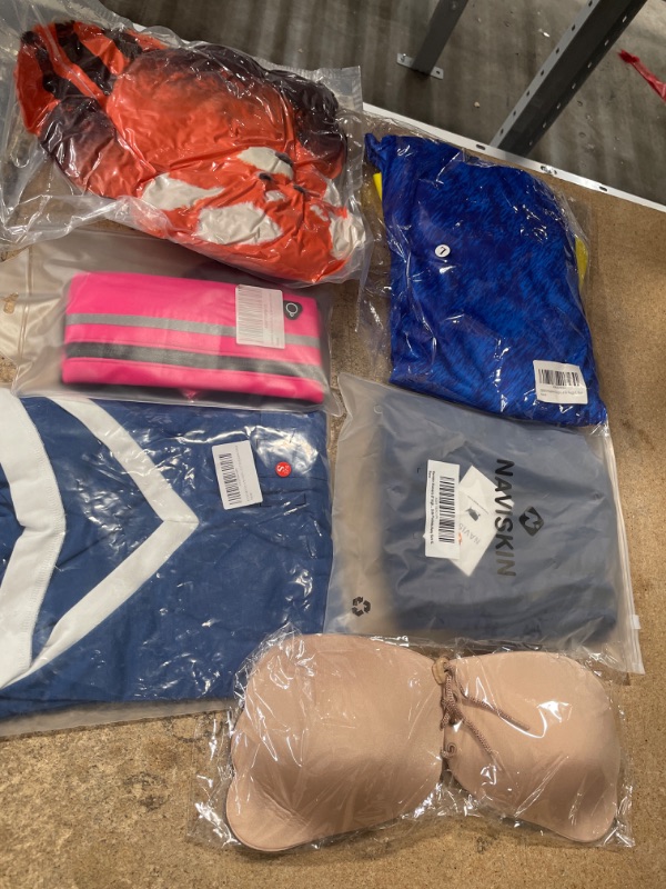 Photo 1 of Bundle bag of of clothes and accessories that includes reflective running/biking/hiking bag, active shorts size xl, and shirt size small, and more. ***6 items***