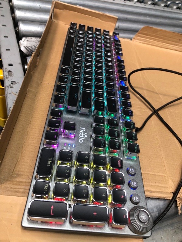 Photo 2 of Fiodio Mechanical Gaming Keyboard, LED Rainbow Gaming Backlit, 104 Anti-ghosting Keys, Quick-Response Black Switches, Multimedia Control for PC and Desktop Computer, with Removable Hand Rest
