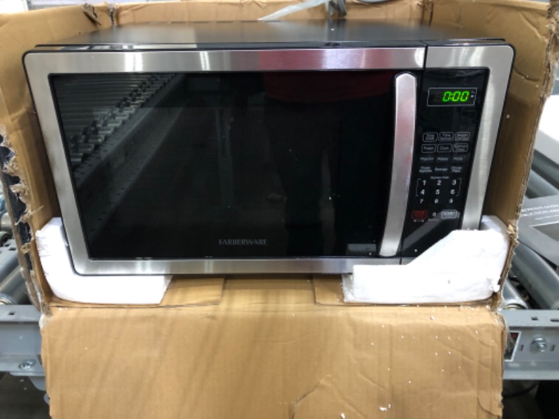 Photo 2 of **PARTS ONLY**
Farberware Countertop Microwave 1.1 Cu. Ft. 1000-Watt Compact Microwave Oven with LED lighting, Child lock, and Easy Clean Interior, Stainless Steel Interior & Exterior
