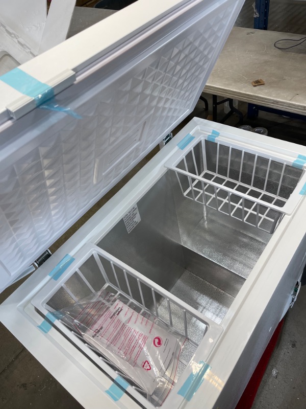 Photo 1 of ***TURNS ON BUT HAS A NOISE WHEN RUNNING, DAMAGE SHOWN IN PICTURE*** KTCF195 38" Chest Freezer with 6.9 Cu. Ft. Capacity Defrost Drain Adjustable Thermostat Metal Backboard Removable Storage Basket in

