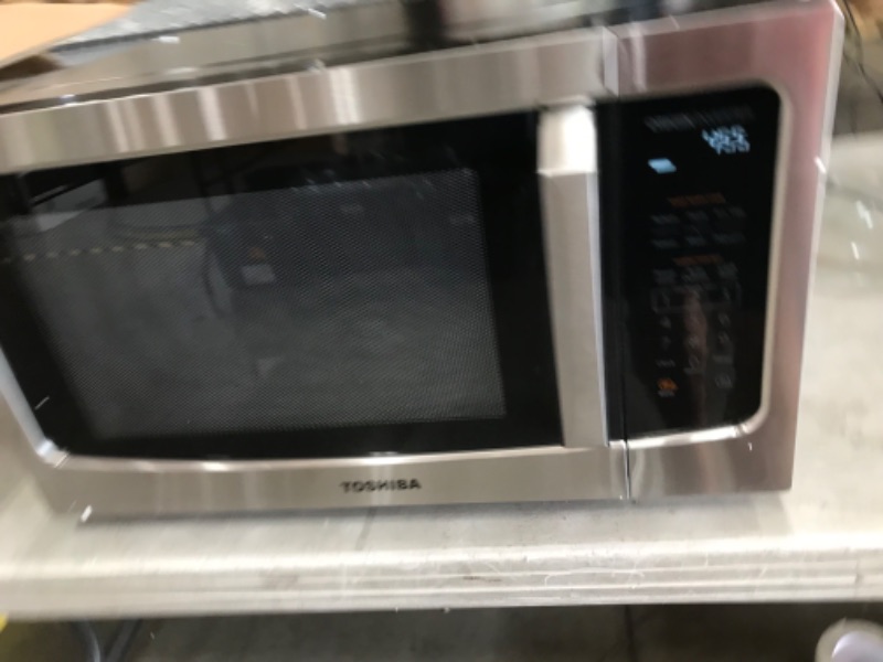 Photo 3 of (DENTED CORNER/SIDE)
Toshiba ML-EM45PIT(SS) Microwave Oven with Origin Inverter Technology, LCD Display and Smart Sensor, 1.6 Cu.ft, Stainless Steel