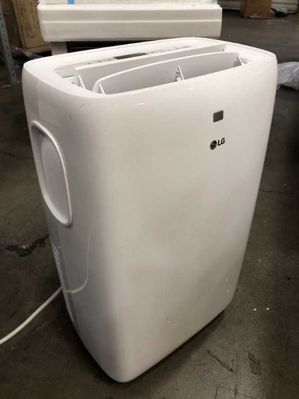 Photo 3 of LG 7,000 BTU (DOE) / 10,000 BTU (ASHRAE) Portable Air Conditioner, Cools 300 Sq.Ft. (12' x 25' room size), Quiet Operation, LCD Remote, Window Installation Kit Included, 115V
