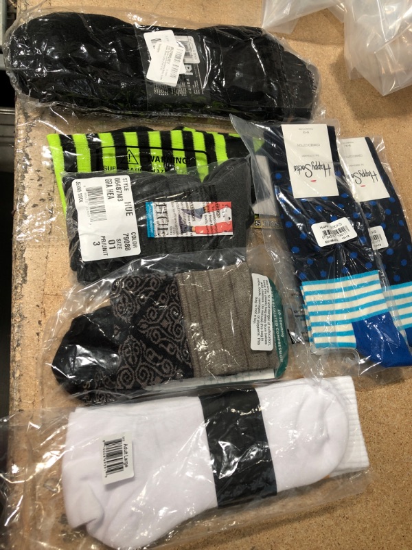 Photo 1 of **NO RETURNS/REFUNDS** - Bundle of assorted socks- large 