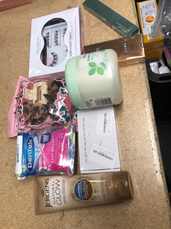 Photo 1 of **NO REFUNDS/RETURNS** Bundle of Assorted self care lotion, lashes, hairclips, etc.
